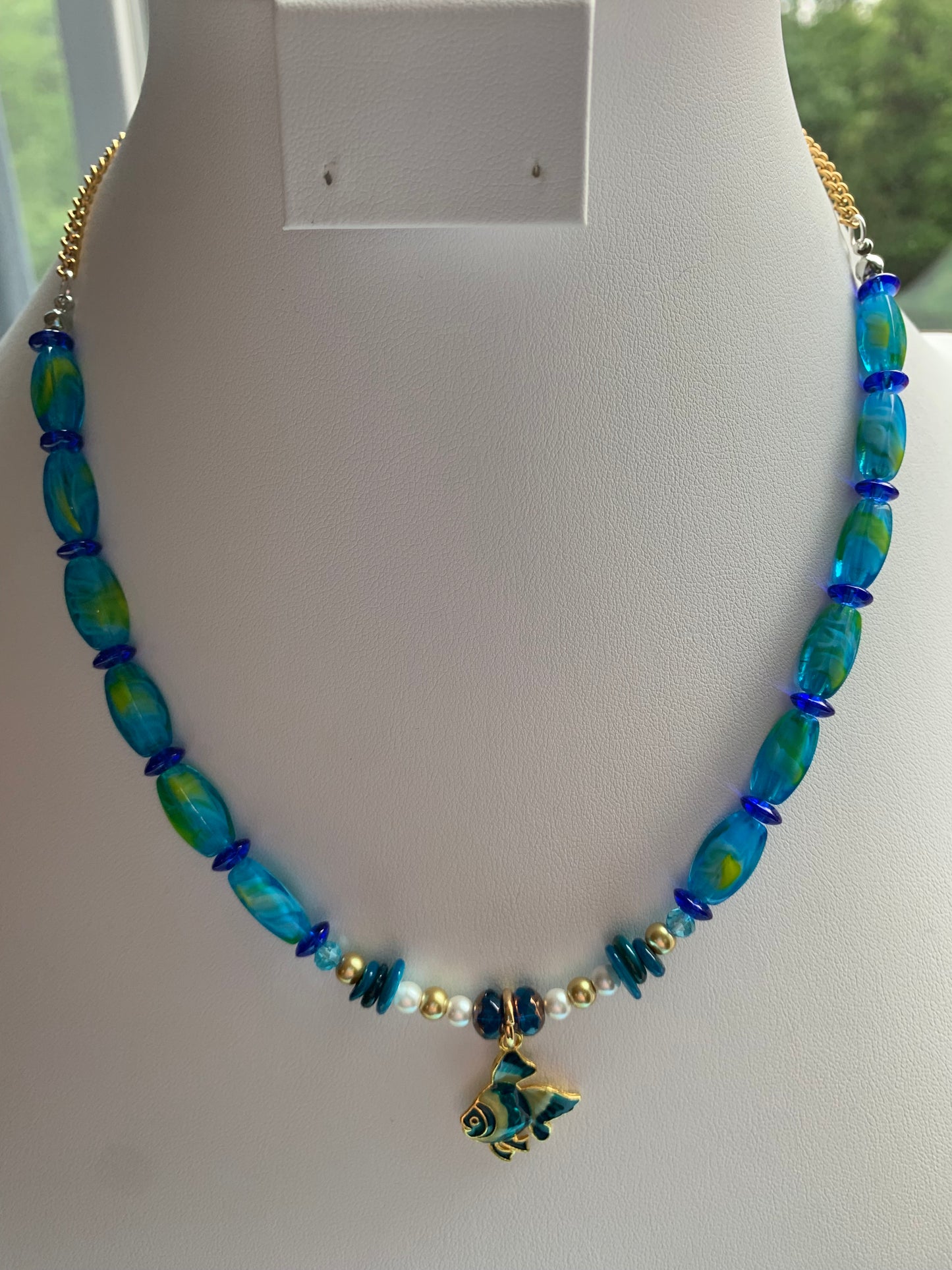 Blue, Green, and Gold Beaded Necklace with Enamel Blue, Yellow, and Gold Fish Charm Pendant and Gold Chain